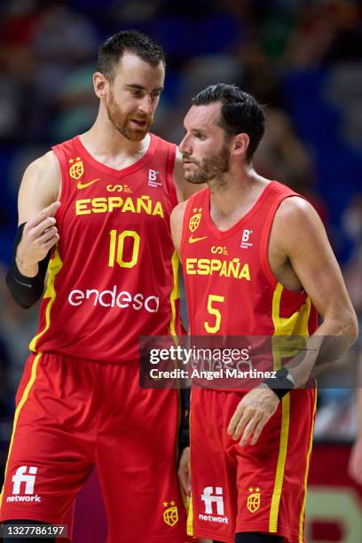 Victor Claver and Rudy Fernandez of Spain interact during an international basketball friendly match between Spain and France at Martin Carpena Arena...