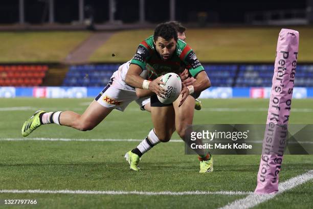 Alex Johnston of the Rabbitohs scores a try during the round 17 NRL match between the South Sydney Rabbitohs and the North Queensland Cowboys at...