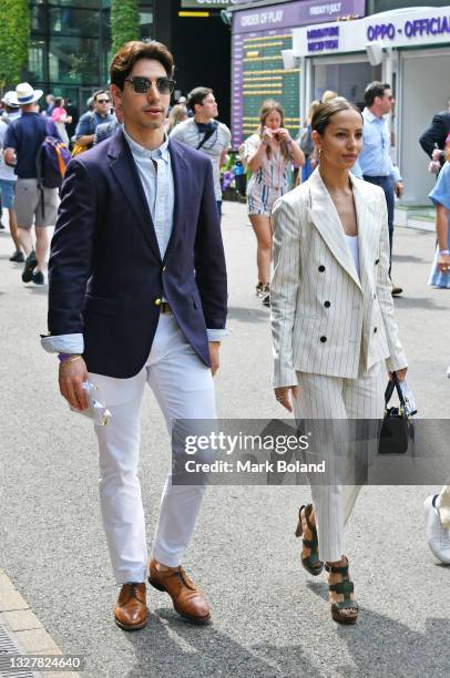 Cesar Corrales and guest attend Wimbledon 2021 at All England Lawn Tennis and Croquet Club on July 09, 2021 in London, England.