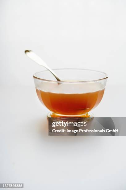 beef bone broth in a glass bowl - bouillon stock pictures, royalty-free photos & images