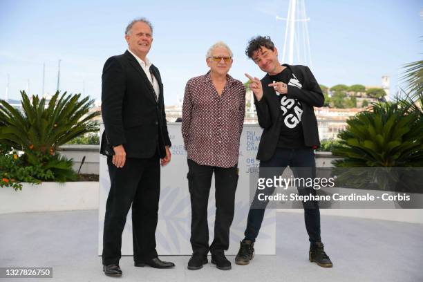Producer David P. Kelly, Producer Jeremy Thomas and Director Mark Cousins attend "The Storms of Jeremy Thomas" photocall during the 74th annual...