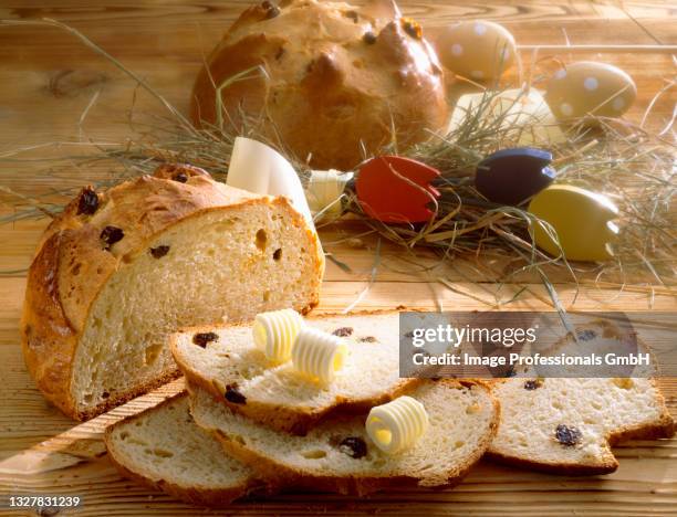 sweet easter bread with sultanas and butter - easter breakfast stock pictures, royalty-free photos & images