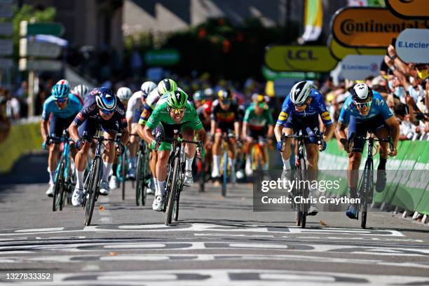 Jasper Philipsen of Belgium and Team Alpecin-Fenix, Mark Cavendish of The United Kingdom Green Points Jersey, Michael Mørkøv of Denmark and Team...