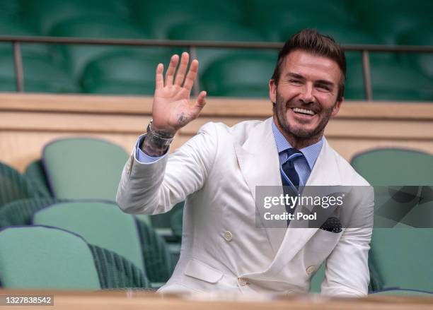 David Beckham, former football player looks on from the Royal Box during the Men's Singles Semi-Final match between Novak Djokovic of Serbia and...