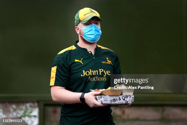 Notts spectator enjoys pre match food during the Vitality T20 Blast match between Notts Outlaws and Yorkshire Vikings at Trent Bridge on July 09,...