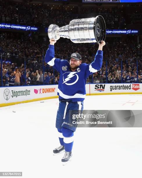 Steven Stamkos of the Tampa Bay Lightning celebrates with the Stanley Cup following the victory over the Montreal Canadiens in Game Five of the 2021...