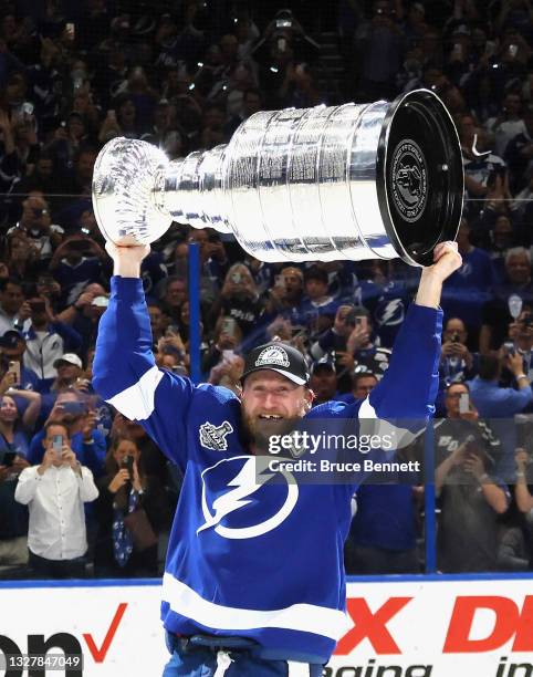 Steven Stamkos of the Tampa Bay Lightning celebrates with the Stanley Cup following the victory over the Montreal Canadiens in Game Five of the 2021...