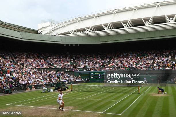 General view of Centre Court as Denis Shapovalov of Canada plays a backhand in his Men's Singles Semi-Final match against Novak Djokovic of Serbia...