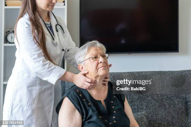 home healthcare - thyroid exam stock pictures, royalty-free photos & images