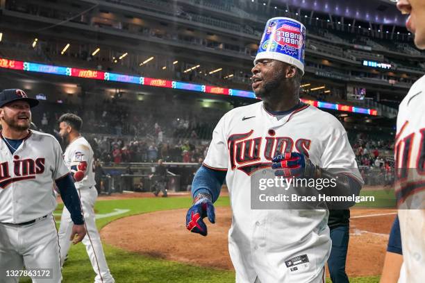 Miguel Sano of the Minnesota Twins celebrates after hitting a walk-off home run against the Cincinnati Reds on June 21, 2021 at Target Field in...
