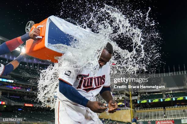 Miguel Sano of the Minnesota Twins is dumped with water during a post-game interview after hitting a walk-off home run against the Cincinnati Reds on...