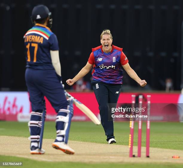 Katherine Brunt of England celebrates after taking the wicket of Shafali Verma of India during the Women's First T20 International between England...