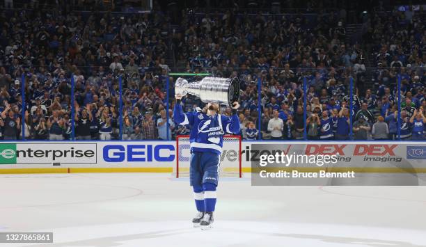 Mikhail Sergachev of the Tampa Bay Lightning celebrates with the Stanley Cup following the victory over the Montreal Canadiens in Game Five of the...