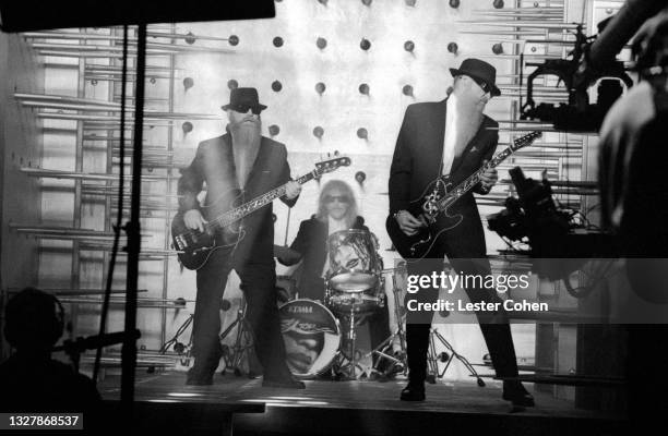 American guitarist Dusty Hill, American drummer Frank Beard and American guitarist Billy Gibbons, of the American rock band ZZ Top, play during the...