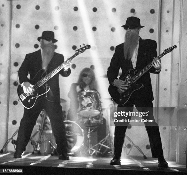 American guitarist Dusty Hill, American drummer Frank Beard and American guitarist Billy Gibbons, of the American rock band ZZ Top, play during the...