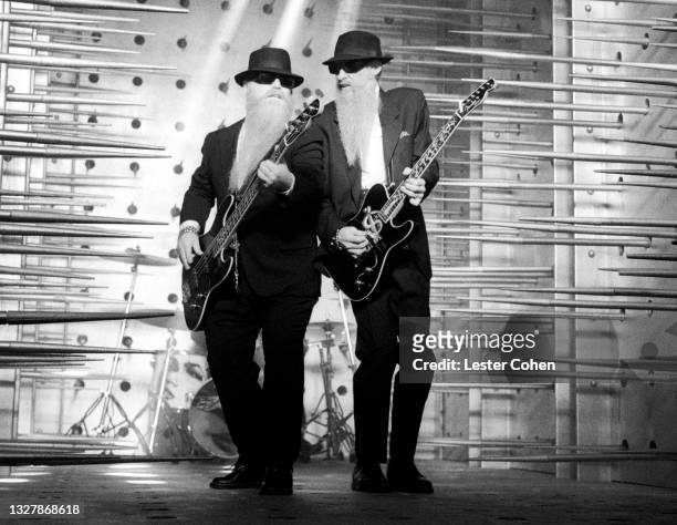 American guitarist Dusty Hill and American guitarist Billy Gibbons, of the American rock band ZZ Top, play during the video shoot for their song...