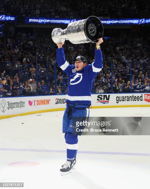 Cal Foote of the Tampa Bay Lightning celebrates with the Stanley Cup following the victory over the Montreal Canadiens in Game Five of the 2021 NHL...