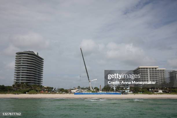 Cranes are operated over the remains from the collapsed 12-story Champlain Towers South condo building on July 09, 2021 in Surfside, Florida. With...