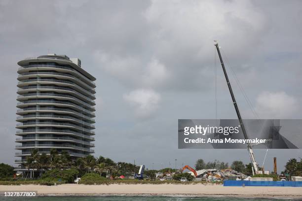 Cranes are operated over the remains from the collapsed 12-story Champlain Towers South condo building on July 09, 2021 in Surfside, Florida. With...