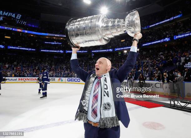 Derek Lalonde of the Tampa Bay Lightning celebrates with the Stanley Cup following the victory over the Montreal Canadiens in Game Five of the 2021...