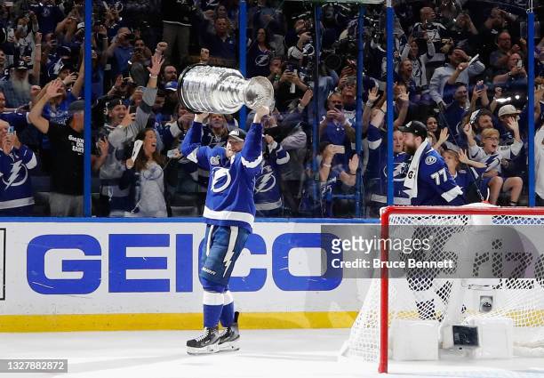 Steven Stamkos of the Tampa Bay Lightning leads the team around the ice with the Stanley Cup following the victory over the Montreal Canadiens in...