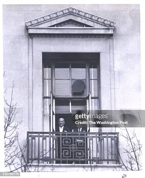 Edgar Hoover and aide Clyde Tolson watch Richard Nixon's inaugural parade from the window of the Justice Department.