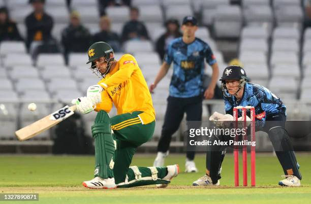 Alex Hales of Notts hits runs ahead of Yorkshire wicket keeper Harry Duke during the Vitality T20 Blast match between Notts Outlaws and Yorkshire...