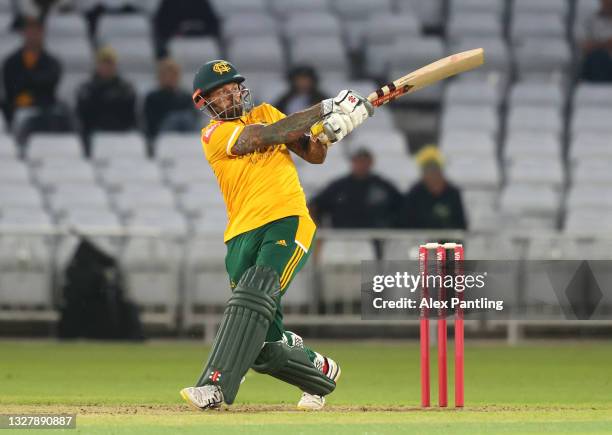 Peter Trego of Notts hits runs ahead of Yorkshire wicket keeper Harry Duke during the Vitality T20 Blast match between Notts Outlaws and Yorkshire...