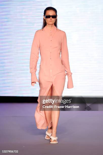 Model walks the runway at the Simonett - Futural Resist FW21 show for Paraiso Miami Beach at The Paraiso Tent on July 09, 2021 in Miami Beach,...