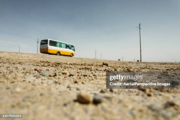 low angle view of bus on the road - bus side view stock pictures, royalty-free photos & images