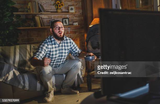 man watching football match at home - sports man cave stock pictures, royalty-free photos & images
