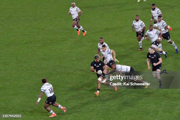 Hoskins Sotutu of the All Blacks looks to offload the ball during the International Test Match between the New Zealand All Blacks and Fiji at Forsyth...