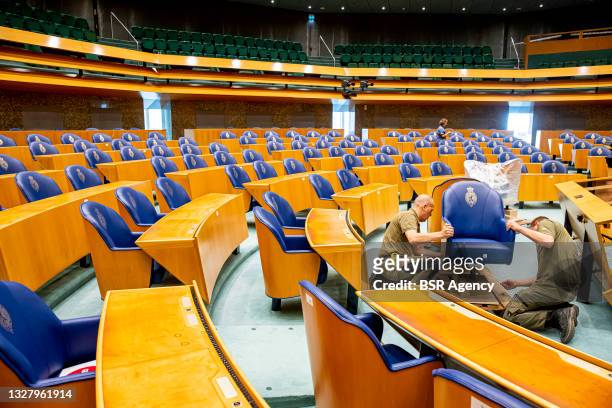 Movers are seen during the start of the relocation of the Tweede Kamer lower house of representatives on July 9, 2021 in The Hague, Netherlands. The...