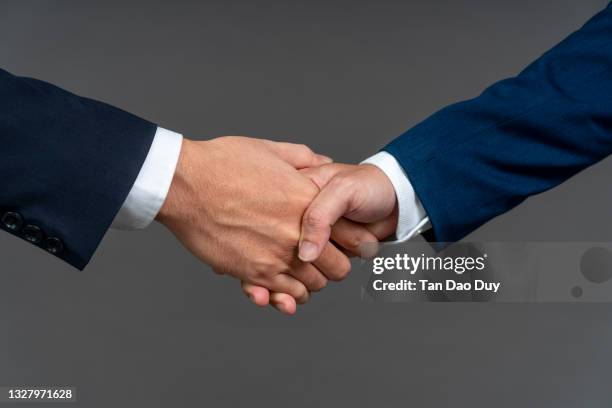 shaking hands - businessman handshake - business people shaking hands - studio silver background, close-up, hight quality image. - customer appreciation stock pictures, royalty-free photos & images