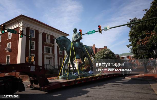 Flatbed truck carries a statue of Confederate General Robert E. Lee from the Market Street Park July 10, 2021 in Charlottesville, Virginia. Initial...