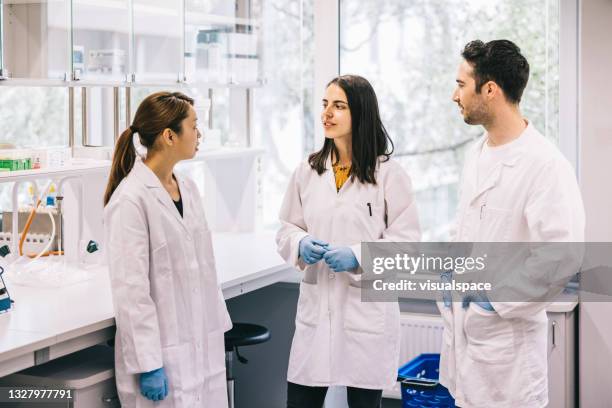 Group Of People In Lab Coats Photos and Premium High Res Pictures ...