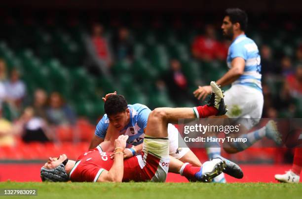 Jonathan Davies of Wales reacts as he appears to be injured after a tackle from Santiago Chocobares of Argentina during the International Friendly...