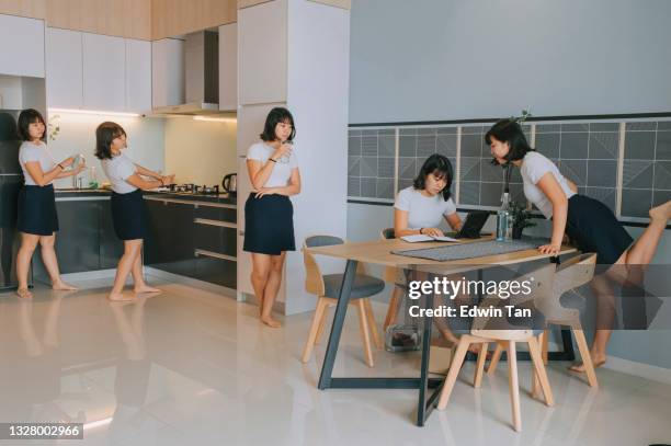 multiple exposure asian chinese teenage girl staying at home using digital tablet, drinking, looking and playful - lifehack stockfoto's en -beelden