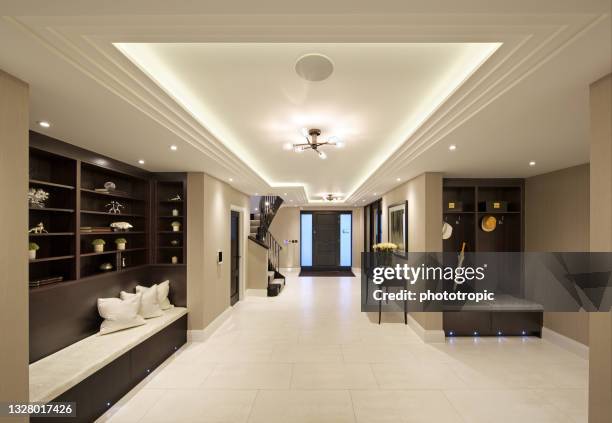 beautiful entrance hall of a new luxury home - downlight stock pictures, royalty-free photos & images