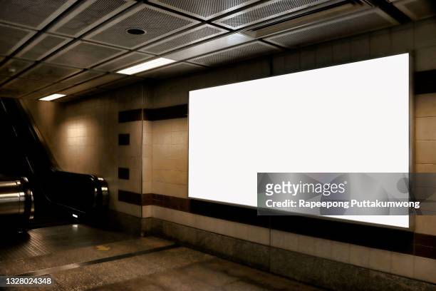 mock up poster media template ads display in subway station escalator - airport lights stock-fotos und bilder