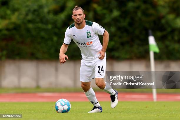 Tony Jantschke of Moenchengladbach runs with the ball during the pre-season Bundesliga match between Borussia Moenchengladbach and Viktoria Koeln at...