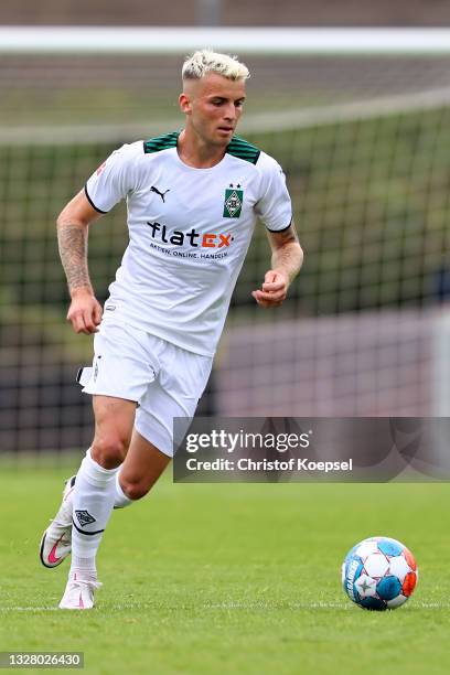 Jordan Beyer of Moenchengladbach runs with the ball during the pre-season Bundesliga match between Borussia Moenchengladbach and Viktoria Koeln at...