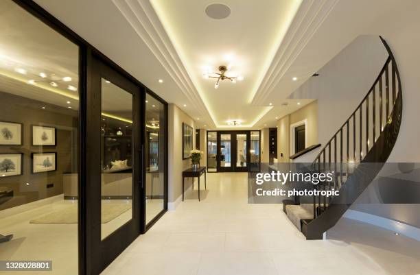 beautiful entrance hall of a luxury home - downlight stock pictures, royalty-free photos & images