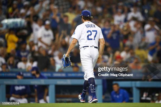 Trevor Bauer of the Los Angeles Dodgers walks in after pitching in the sixth inning against the San Francisco Giants at Dodger Stadium on June 28,...