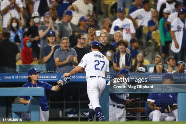 Trevor Bauer of the Los Angeles Dodgers walks in after pitching in the sixth inning against the San Francisco Giants at Dodger Stadium on June 28,...