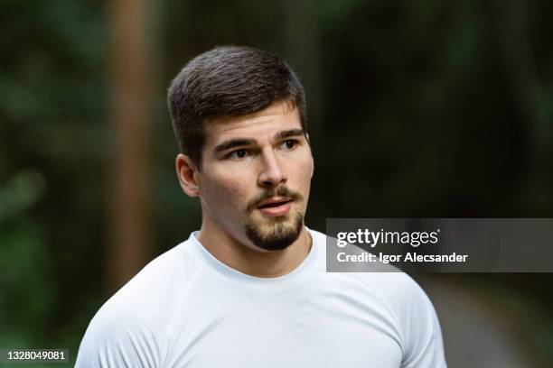 sportsman taking a breath in the natural park - panting stock pictures, royalty-free photos & images