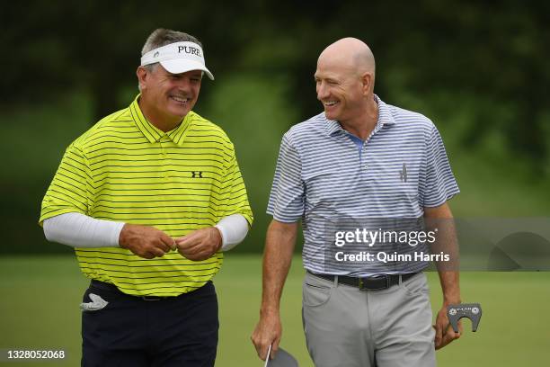 Steve Flesch and Paul Goydos seen laughing after the ninth hole during the third round of the U.S. Senior Open Championship at the Omaha Country Club...