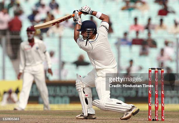 Indian batsman Gautam Gambhir plays a cover drive during the first day of second Test match between India and West Indies at Eden Gardens stadium on...