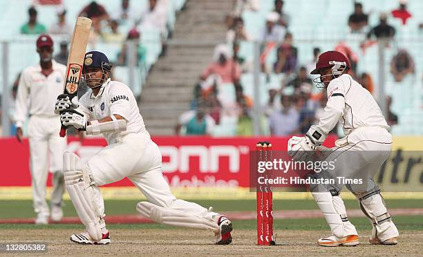 Indian batsman Sachin Tendulkar plays a shot during the first day of second Test match between India and West Indies at Eden Gardens stadium on...