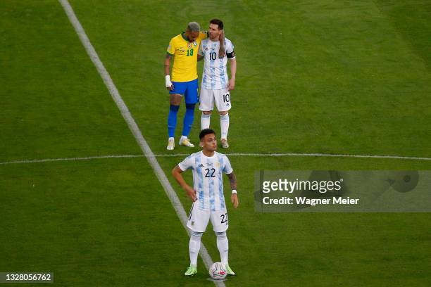 Neymar Jr. Of Brazil hugs Lionel Messi of Argentina as Lautaro Martinez of Argentina prepares for kick off prior to the final of Copa America Brazil...